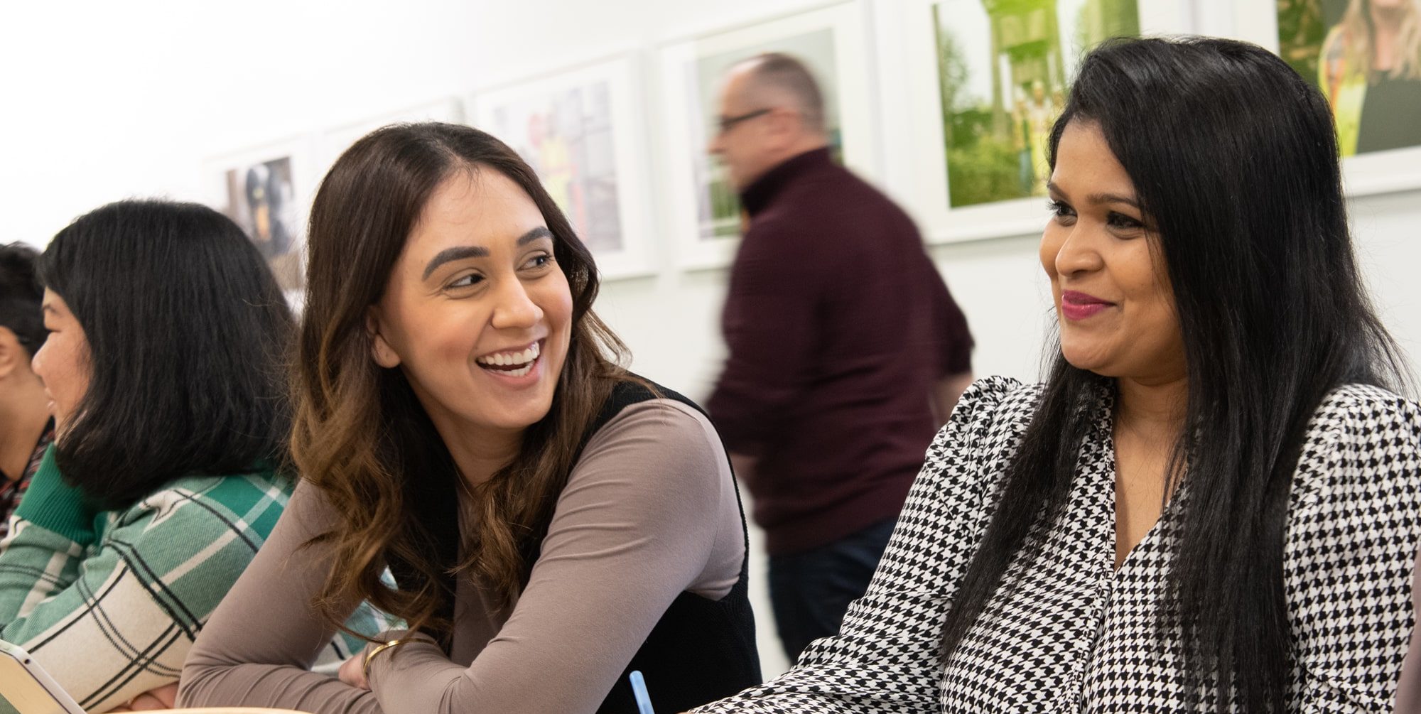 A picture of two people smiling at each other