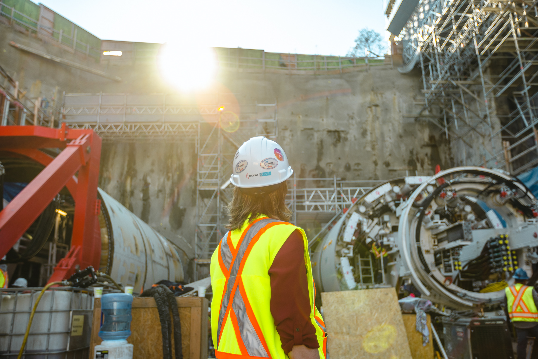 A picture of construction worker staring at the sun