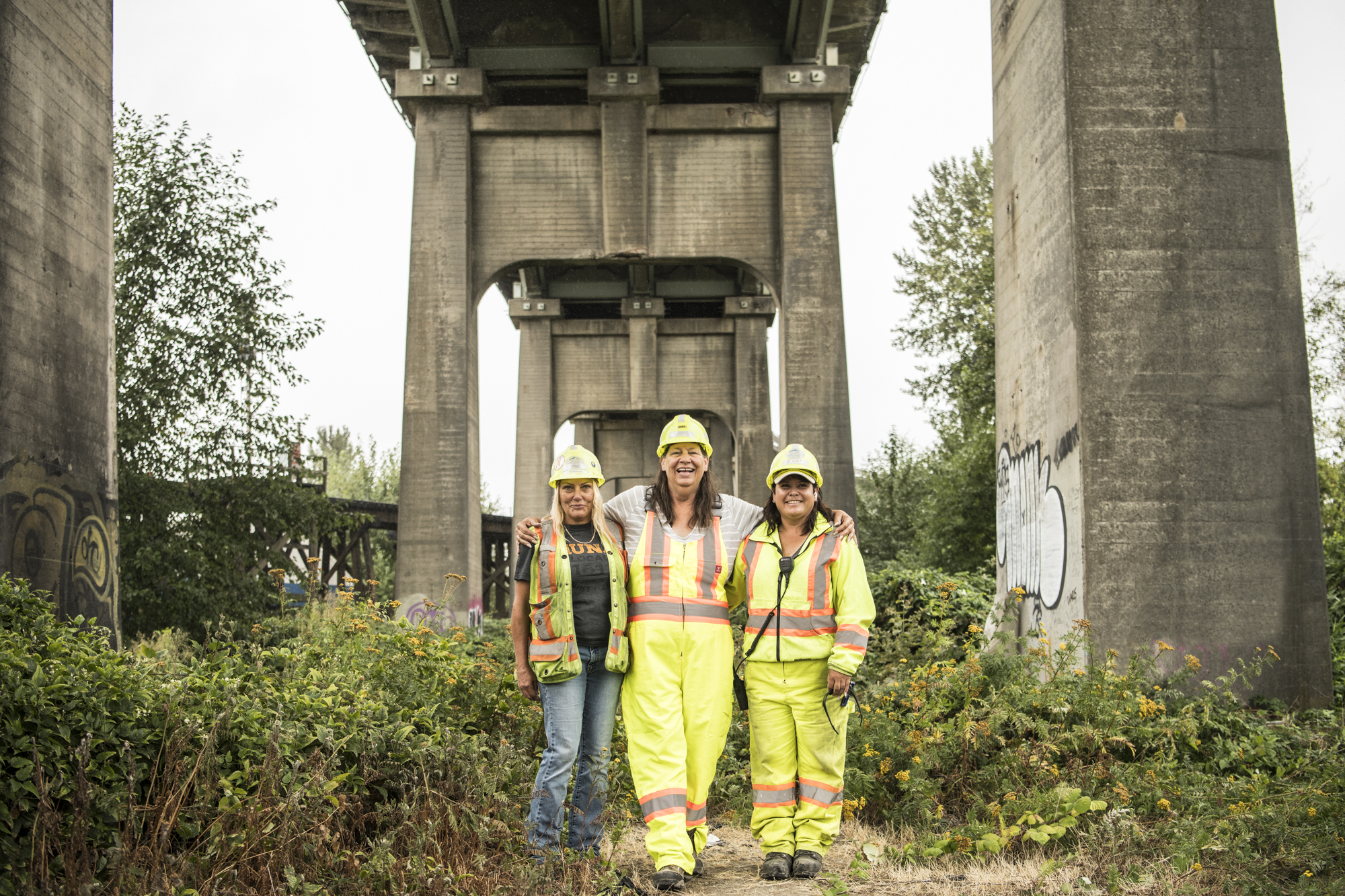 An image of three smiling female workers