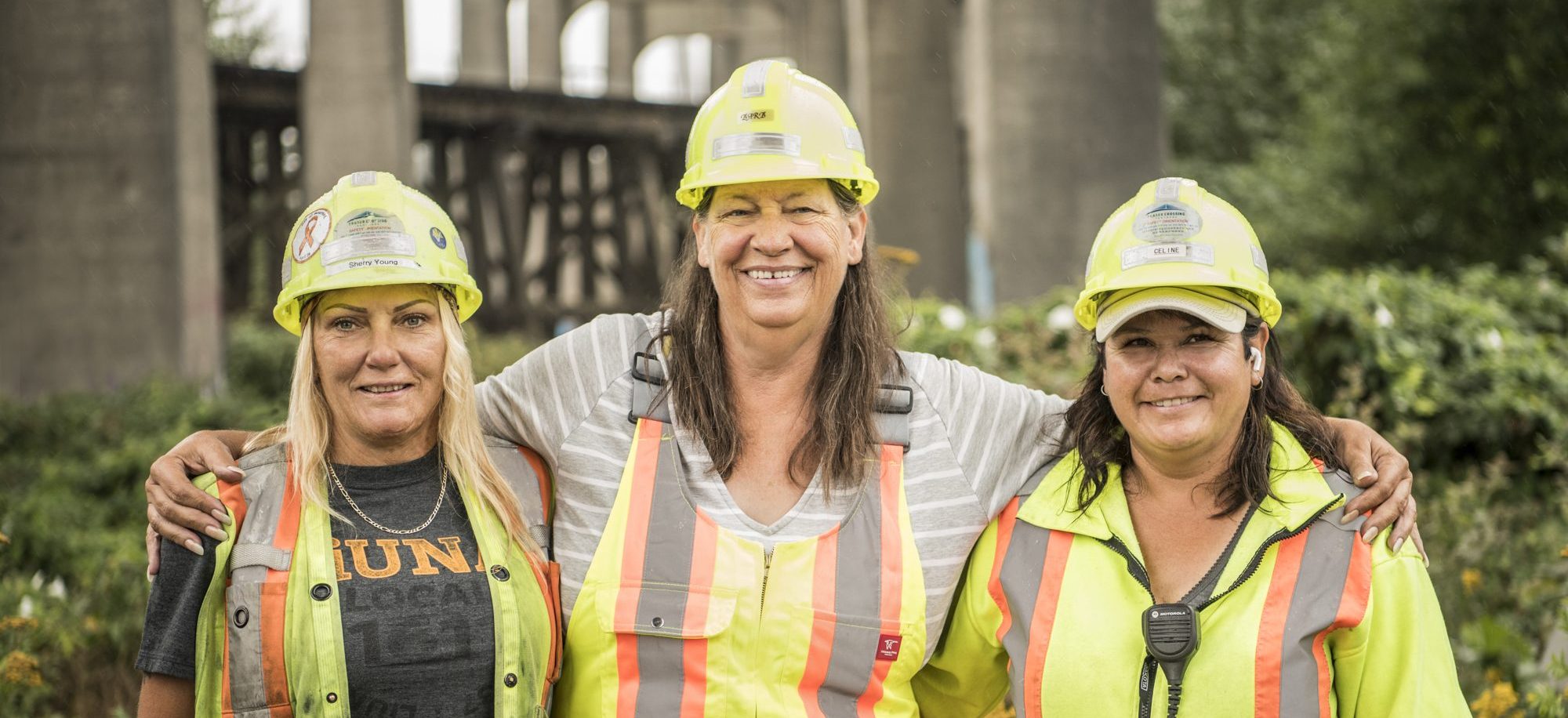 Three trades women under the old Pattullo bridge.
